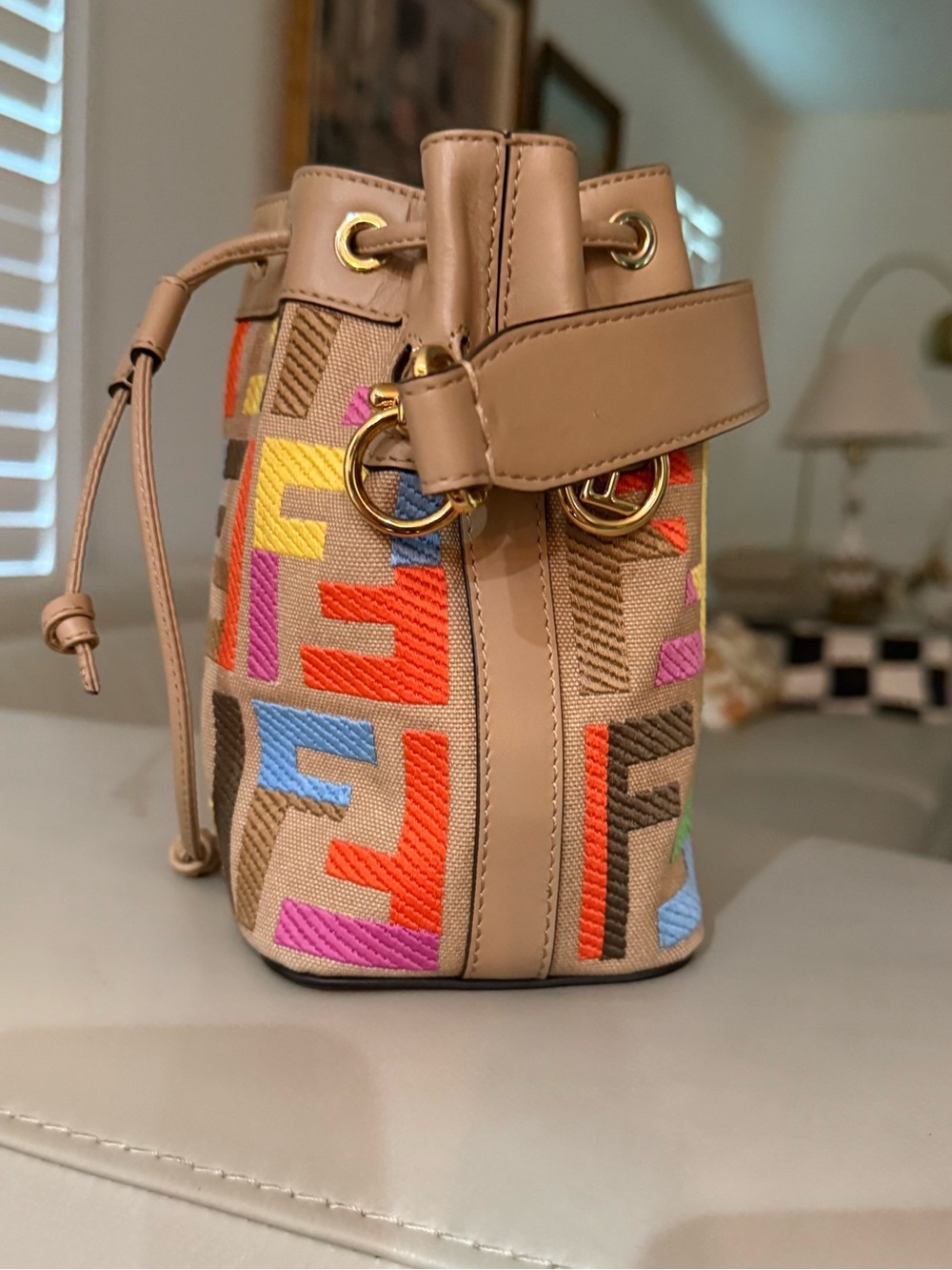 Neutral Embroidered Mini Bucket Bag with Multicolor Motif